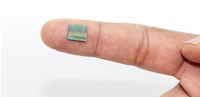 LiDAR microchip shown on an index finger
