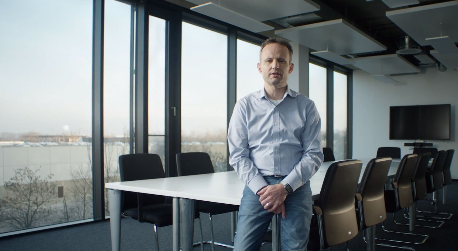 a photo of Alex HItzinger the CEO of Artemis Volkswagen Group in a meeting room